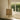 Columbo alabaster table lamp on a window ledge beside a sash window and garden