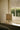 Columbo alabaster table lamp on a window ledge beside a sash window and garden
