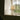 Acropolis table lamp on a window ledge with green garden view