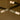 Close-up of glass shades at the ends of crossing bronze strands on the Trace Linear chandelier