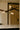 Close view of the Trace Linear chandelier strands crossing above a marble kitchen island
