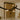 Crossing bronze strands of the Trace Linear chandelier above a kitchen island, seen closer