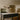 Trace Linear chandelier above a marble-topped kitchen island in a kitchen with oak cabinets
