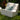 White Check chair with a teal pillow on a lawn