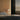 Ciro Wall light by Pablo Designs in Sand, bedside setting
