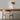 Ciro Wall light by Pablo Designs in Clay, mounted above a desk