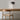 Ciro Wall light by Pablo Designs in Graphite, mounted above a desk
