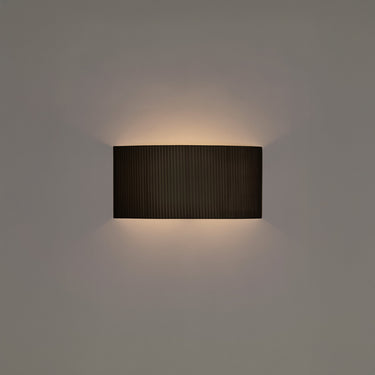 Comodin Rectangular Wall Lamp by Santa & Cole in Black Ribbon finish with warm ambient LED lighting