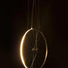 Eddy by Cyclampa glowing at night, a ring of LED light on a bicycle wheel