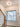 ET2 Cycle flush mount on the ceiling of a stairwell landing beside a window and wood handrail