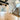 ET2 Cycle flush mounts on the ceiling of a hallway beside a staircase under black beams