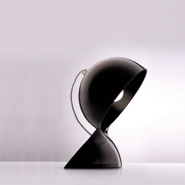 Black DALU table lamp by Artemide with curved thermoplastic body for modern desks or bedside lighting