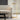 Dessau floor lamp, illuminated arm rotated, showcasing directional task light, brass finish