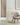 Dessau 46 inch warm brass LED floor lamp providing focused reading light next to an armchair.