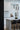 ET2 Diaphane black tube pendants with rock crystal tips over a gray kitchen island with black stools