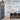 ET2 Diaphane black tube pendants in a row over a white modern kitchen island