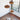 Natural Disc pendants at different heights above a chair by a window, Graypants Scraplights cluster