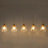 Modern Brass Glass Linear Chandelier in Dining Room