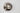 ET2 Wink wall sconce, Satin Nickel, angled unlit view of the half-dome on a pale wall