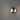 ET2 Wink wall sconce, Satin Nickel, lit, wide view showing the glow spreading across a grey wall