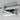 ET2 Dorian rotating twin tube wall sconce, 22 in Polished Chrome, close-up of the pivot and backplate