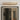ET2 Braque faceted aluminum picture light in Gold mounted above a framed abstract artwork on a gray wall