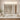 ET2 Alto bath vanity light above a bathroom mirror over a wood vanity with a single sink