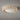 ET2 Cambria 13 in plaster flush mount seen from below, a cream ring with oval cutouts around a white glass center on a gray ceiling
