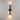 ET2 Reveal Outdoor banded tube wall sconce, 20 in Black, lit with light washing up and down the wall