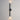 ET2 Reveal Outdoor banded tube wall sconce, 28 in Black, lit with light washing up and down the wall, angled view