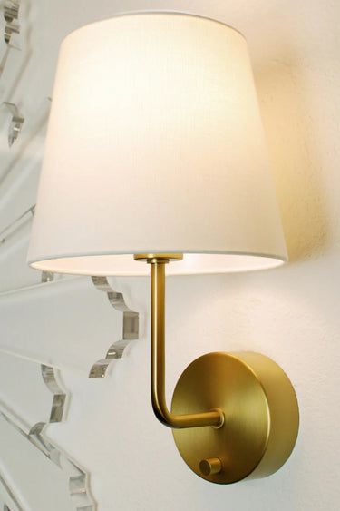 Emily Cordless Wall Sconce Antique Brass by Modern Lantern mounted on a modern wall