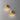 Two matt gold Penta Enoki wall sconces glowing on a wall