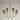 Gold Chandelier illuminating a dining room with Goblet-Shaped Shades
