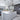 ET2 Fizz III mini pendants over a gray kitchen island that opens to a living room