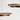 Grace 30 inch LED pendant light fixture suspended from a vaulted ceiling in a hotel lobby