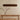 Disc 48 Linear pendant in Natural cardboard hanging over a rectangular dining table