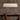 Graypants Handcrafted Linear Pendant - Scraplights Recycled Material in WHite Finish on top of a dining table