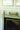 Mantel 14" Uplight in Antique Brass styled in a lived-in room – House of Troy