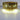 Elegant metal chandelier casting soft diffused light in office space