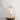 Ivory White Jingoo by Daqiconcept lit softly against a pale wall