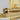 Brass LED vanity fixture with industrial detailing for upscale home and commercial bathrooms