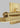 Brass LED vanity fixture with industrial detailing for upscale home and commercial bathrooms