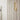 Natural brass LED wall sconce with modern industrial look, ideal for upscale powder rooms or vanities