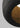 Black ceramic pendant light with textured surface for restaurant bar lighting or kitchen island task lighting