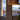 Kerflights wood drum pendant in a tall penthouse-style Graypants interior photograph