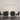 A custom configuration of Z-Bar linear LED pendants in a minimalist conference room.