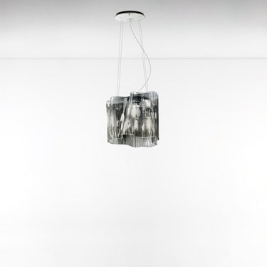Modern grey smoke glass suspension lamp by Artemide, ideal for dining rooms and living spaces