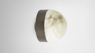 Lucid wall light with bronze band and honed alabaster dome, side view
