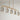 Sleek Brass Linear Pendant Light with 6 Lights Over Kitchen Island