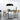 Oluce Canopy black pendant lamp over a dining table in a bright white room